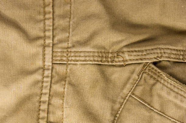 istock clothing items washed cotton fabric texture with seams 1073344070