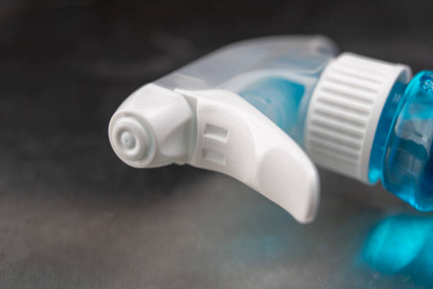 istock Bottle for window cleaning liquid. Accessories for house cleaning. Light background. 1073357646