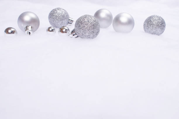 istock Christmas baubles on snow cover. 1073362602
