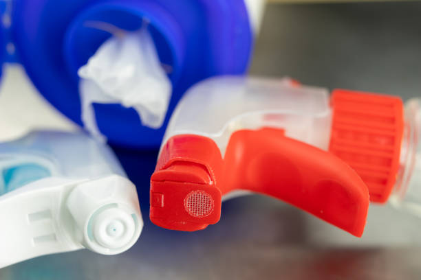 istock Bottle for window cleaning liquid. Accessories for house cleaning. Light background. 1073365860