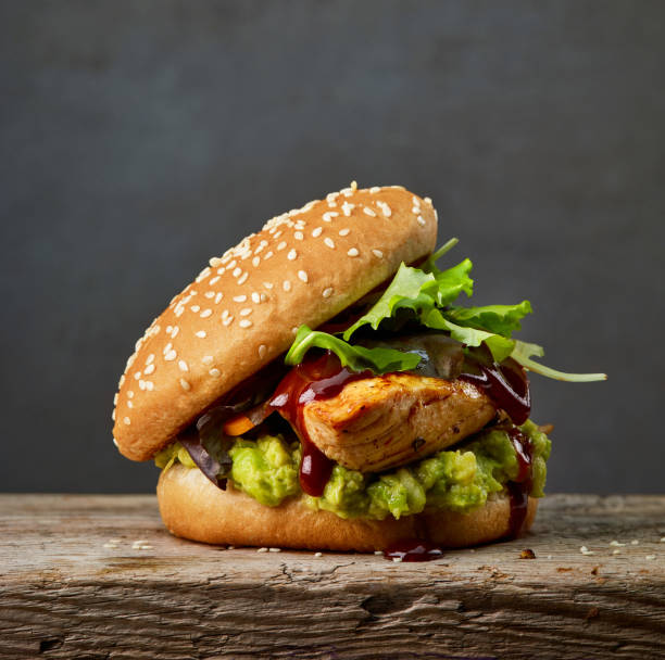istock burger with chicken meat and avocado 1073377772