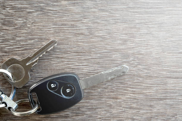 The car keys on wooden floor. The car keys on wooden floor. car keys table stock pictures, royalty-free photos & images