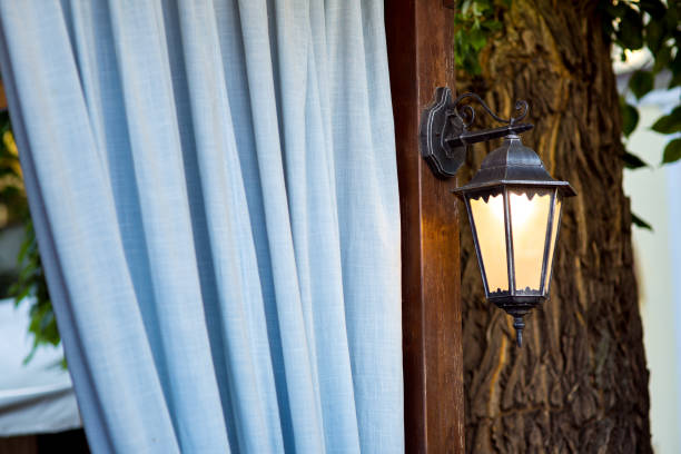a street lamp on a brown pillar.