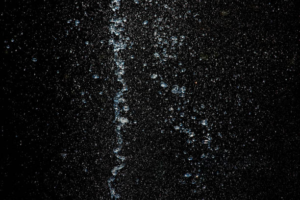 istock the Splashes of liquid on a black. 1073381766