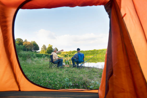 istock Two men relaxing and fishing 1073382314