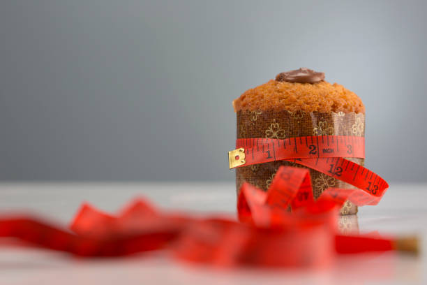 istock Muffin with tape measure 1073399772