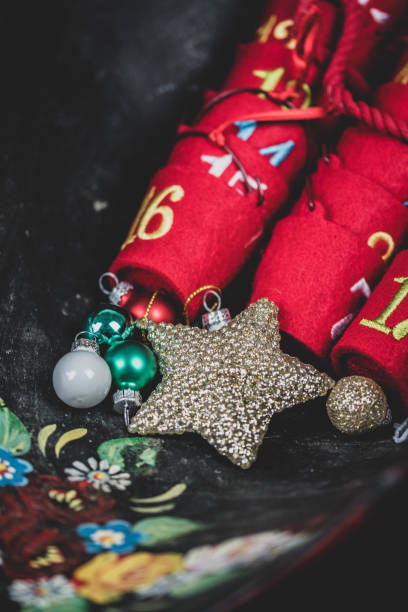 istock Top down view of advent sweet holders with December dates on them. 1073402852