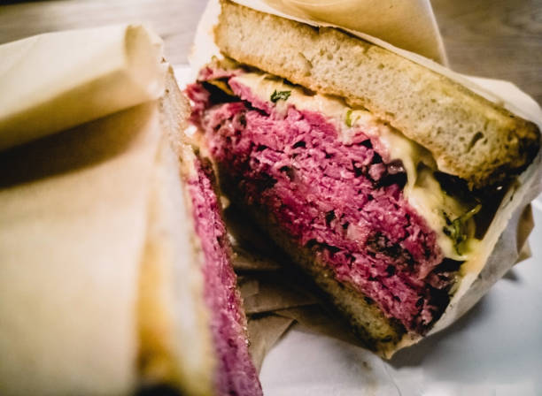 Reuben sandwich with pastrami Closeup photo of newyorker Reuben sandwich with pastrami pastrami stock pictures, royalty-free photos & images