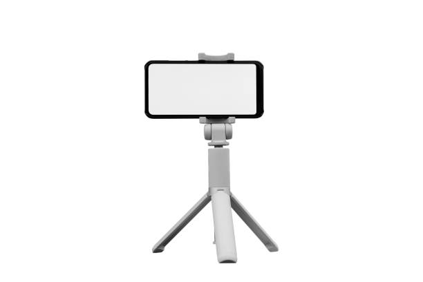 istock Mock up of smartphone with white screen and tripod, isolated on white background 1073414778