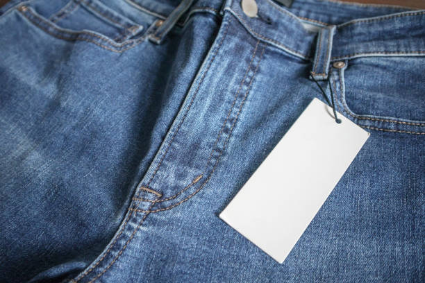 istock Blue jeans with blank white price label tag 1073415430