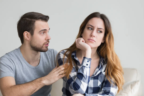 Wife offended by husband, man asks forgiveness Wife offended by husband, man asks for forgiveness. Angry depressed young woman has no desire to talk, listening to lies of her boyfriend saying sorry. Troubles in family, misunderstanding, distrust impatient stock pictures, royalty-free photos & images