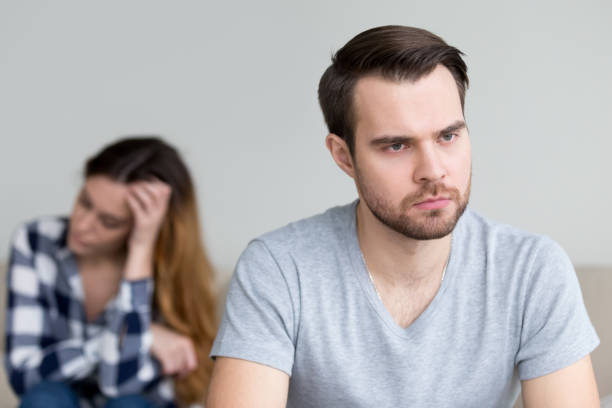 istock Head shot portrait sad, frustrated, desperate young man 1073416260