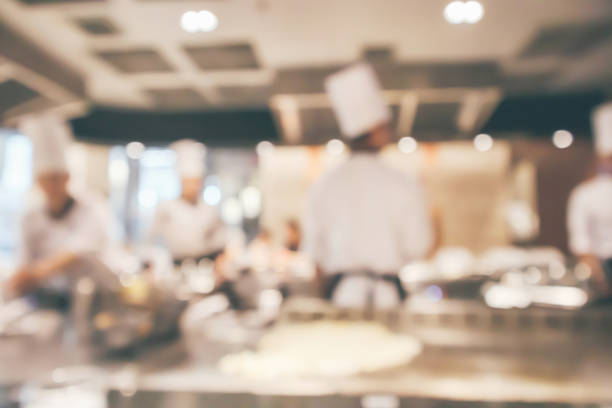 istock Chef cooking in restaurant kitchen blurred defocused background 1073416324