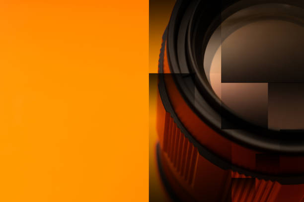 part of photo lens on orange background with drawn pattern - ideas concepts aperture black imagens e fotografias de stock