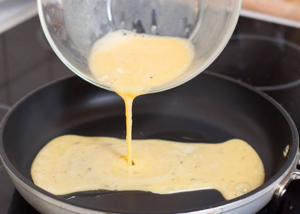 istock Preparation of omelette with shrimps 1073416910
