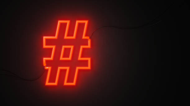istock Hashtag Symbol Shaped Red Neon Light On Black Wall - Online Messaging Concept 1073429036