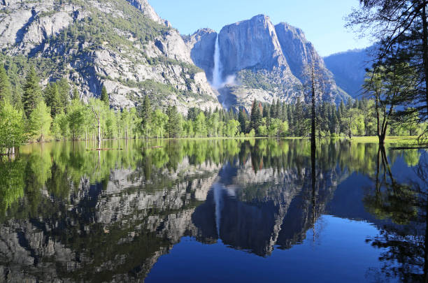 istock Symmetric landscape with river and falls 1073440604