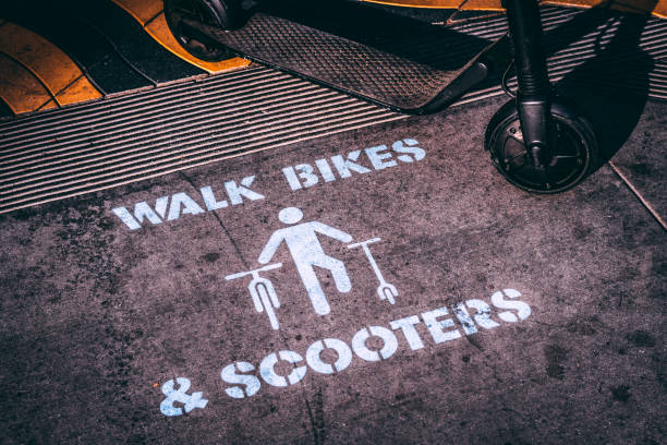 istock A walk bikes and scooters road marker on a sidewalk 1073444056