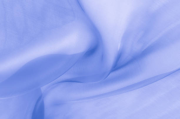 istock Texture, background, pattern. Pale blue clear silk cloth. SKY BLUE, also known as PALE BLUE, BABY BLUE, POWDER BLUE 1073450018