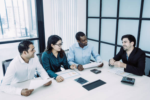 istock Content boss conducting meeting with employees 1073454738