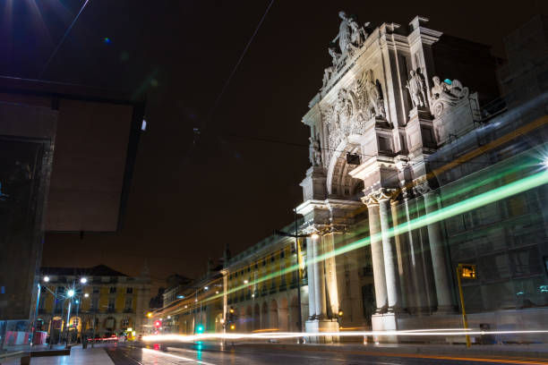 istock The Comercio square and the Augusta Arch at night with light tails. 1073464854
