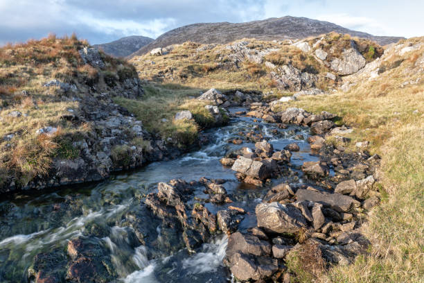 istock Maumturk Mountain Stream, Graffa More, Galway, Ireland 1073465546
