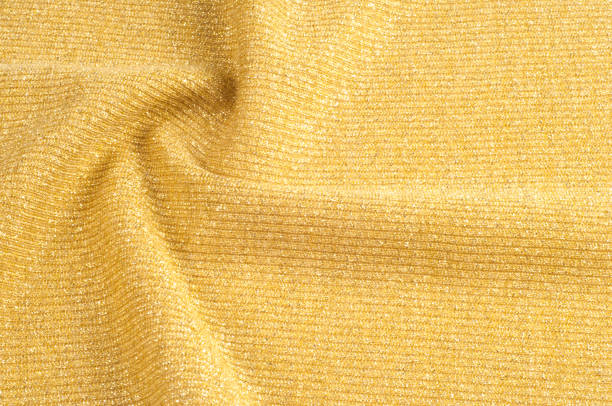 istock Texture, background, pattern. Fabric of a golden hue. Bronze Shade Scale Mermaid Sequin Fabric by Yard Light Golden 1073467820