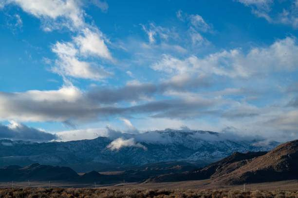 istock cloudy November sky over eastern Sierra Nevada mountains, hills 1073470388