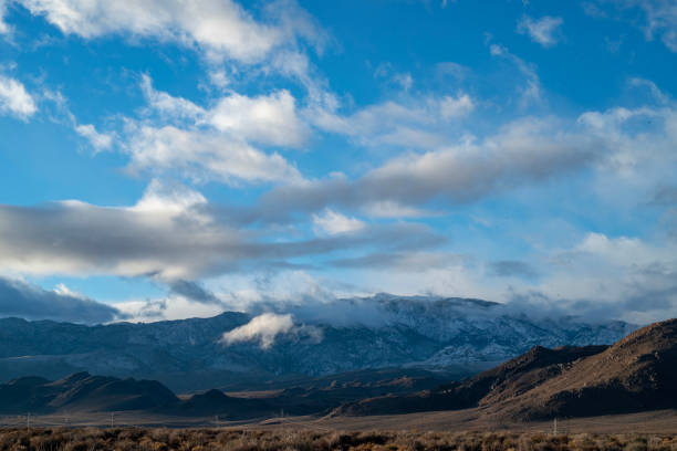 istock cloudy November sky over eastern Sierra Nevada mountains, hills 1073471552