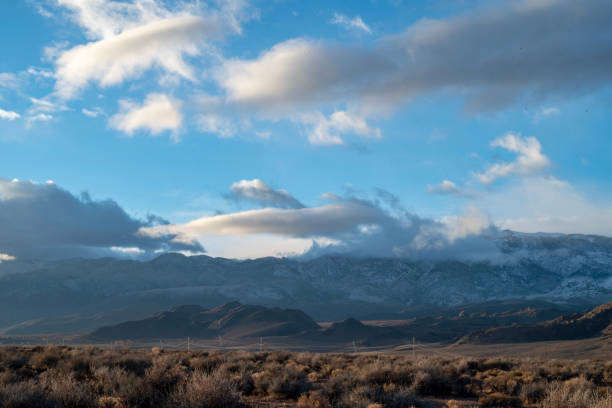 istock cloudy November sky over eastern Sierra Nevada mountains, hills 1073471628