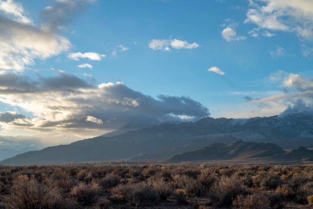 istock cloudy November sky over eastern Sierra Nevada mountains, hills 1073473898