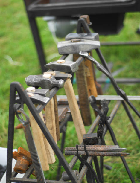 istock Flea market, folk crafts. Blacksmith for work, The tool forged. smith, farrier, forger, smithy, hammersmith 1073474376