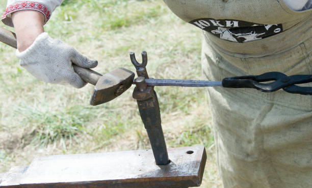 istock Flea market, folk crafts. Blacksmith for work, The tool forged. smith, farrier, forger, smithy, hammersmith 1073474380