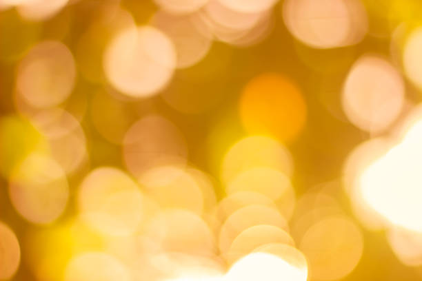 istock Abstract glamorous white silver and gold bokeh lights glitter sparkle. Defocused background have luxury golden color party invite for birthday, anniversary, holliday, new yearâs eve or Christmas. 1073478870
