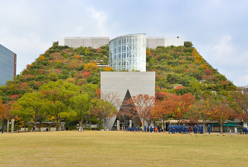 Fukuoka, Japan- November 25, 2018: ACROS international hall with the step garden on top is seen from the street in Tenjin area, Fukuoka, Japan