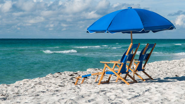 istock Lounge Chairs and Umbrella 1073482080