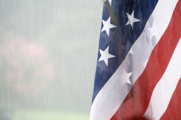 istock american usa flag with rainy weather 1073489366