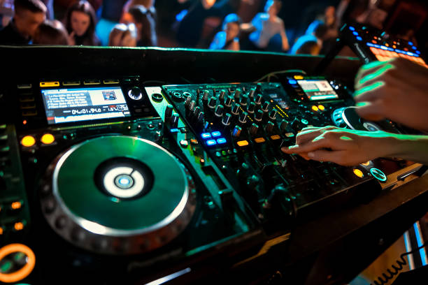 istock Dj mixing in night club 1073492332