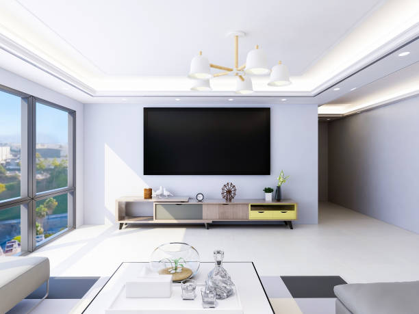 istock Spacious and bright modern living room design with TV, sofa and coffee table, sunlight shining into the room through huge glass windows 1073492700