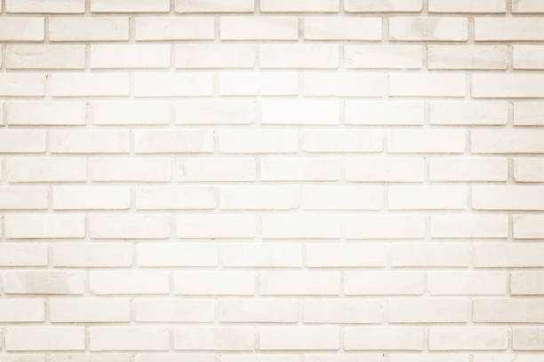 istock Cream and Brown brick wall texture background. Brickwork or stonework flooring interior rock old pattern clean concrete grid uneven bricks design stack. 1073502976