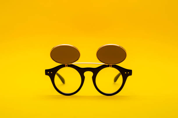 istock Sunglasses with double glass on a yellow background 1073507298