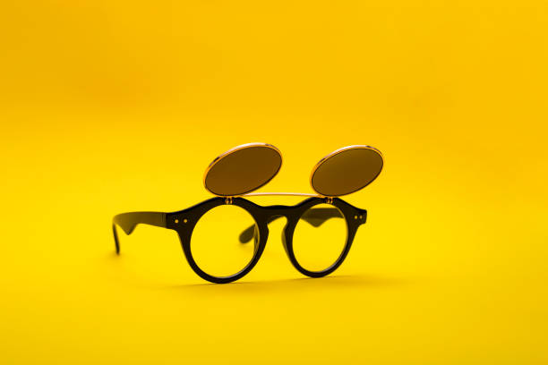 istock Sunglasses with double glass on a yellow background 1073507306
