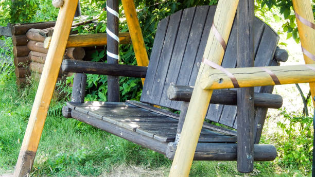 istock Wooden swing for two in the park 1073513068