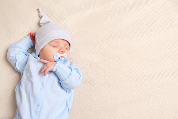 istock Cute baby sleeping on bed 1073525186