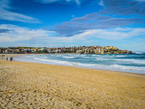 An empty beach in Sydney, Australia; blue sky, blue water and yellow sand