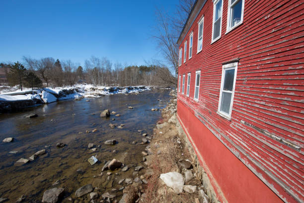 The Israel River flows past an historic building.