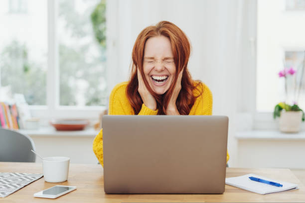 istock Young woman laughing at a good joke 1073552068