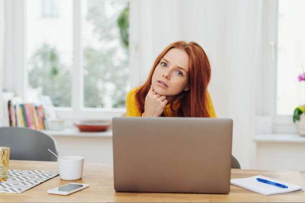 istock Concerned young businesswoman looking at camera 1073552116
