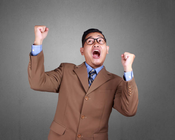 istock Young Businessman Winning Gesture 1073552132