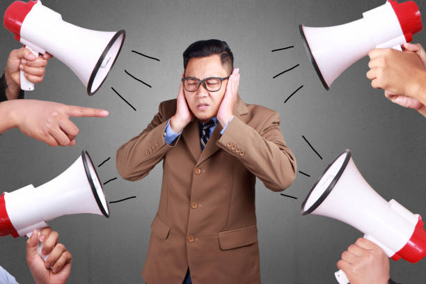 Man Covered his Ear Ignoring Noise Young asian businessman covered his ear ignoring noise. Stressed under pressure concept man closing ears photos stock pictures, royalty-free photos & images